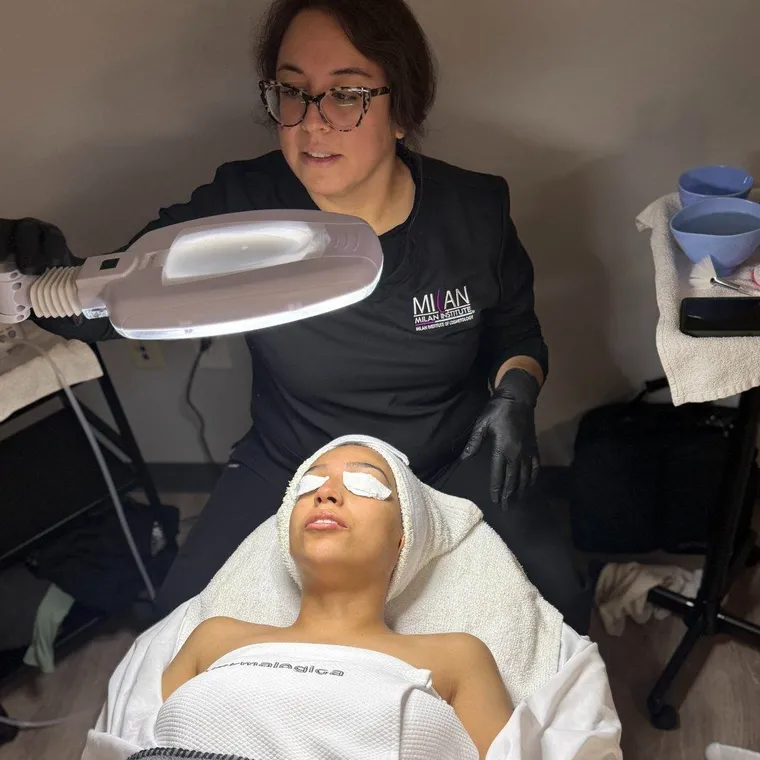Natalie performing a facial treatment at HoneyDew Skin Studio
